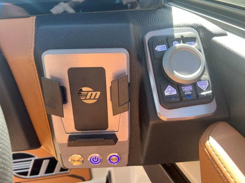Slide: The Image of Dashboard controls of 2025 Malibu 23 LSV boat with modern design. - 11