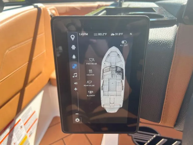 Slide: The Image of Touchscreen control panel in 2025 Malibu 23 LSV boat, displaying navigation and system settings. - 18