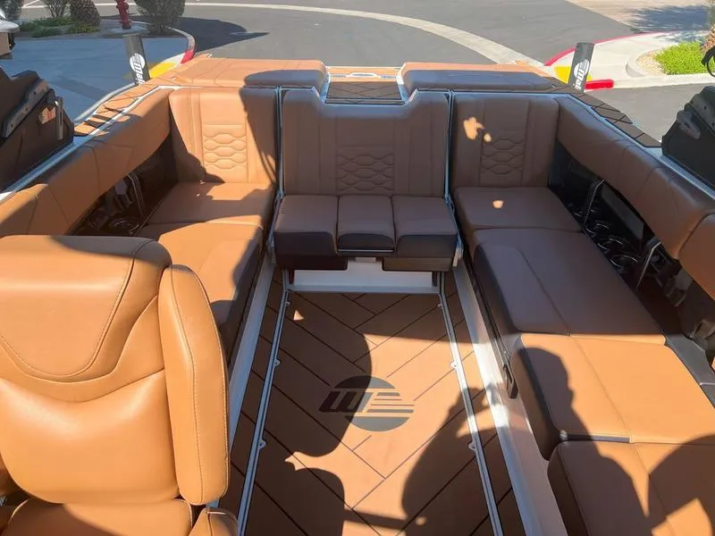 Slide: The Image of Luxurious interior of 2025 Malibu 23 LSV boat with tan leather seating. - 8