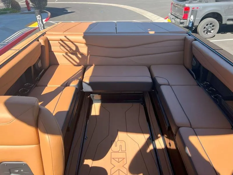 Slide: The Image of 2025 Axis A225 boat interior with tan leather seating and spacious layout. - 17