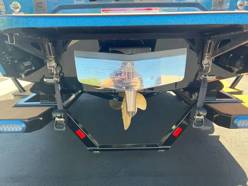 Slide: The Image of 2025 Axis A225 boat stern with propeller and wakeboard features. - 19