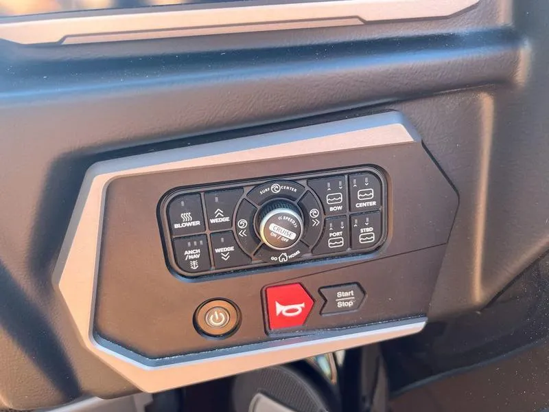 Slide: The Image of Control panel of 2025 Axis A225 boat with various function buttons and switches. - 24