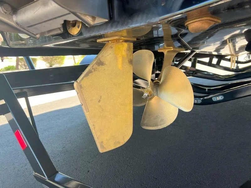 Slide: The Image of 2025 Axis A225 boat propeller and rudder detail on trailer. - 25