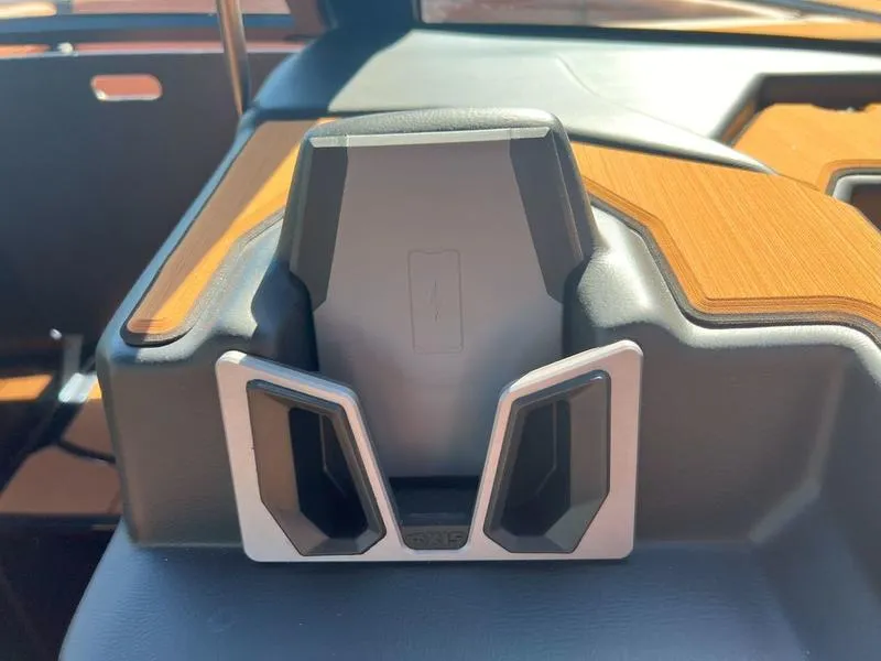 Slide: The Image of Axis A225 2025 dashboard with sleek phone holder and wood accents. - 28