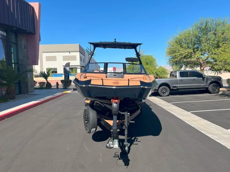 Slide: The Image of 2025 Axis A225 boat on trailer in parking lot, sunny day. - 6