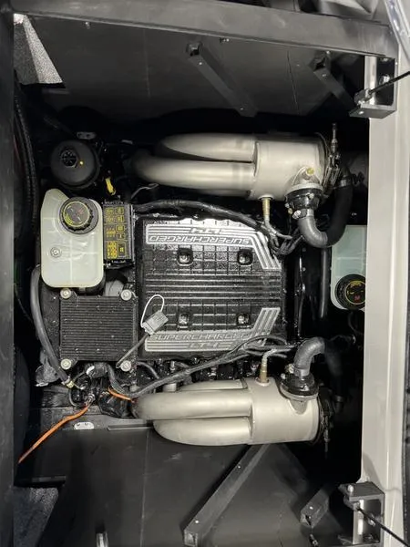 Slide: The Image of 2024 Malibu 25 LSV engine compartment showcasing powerful marine engine components. - 12