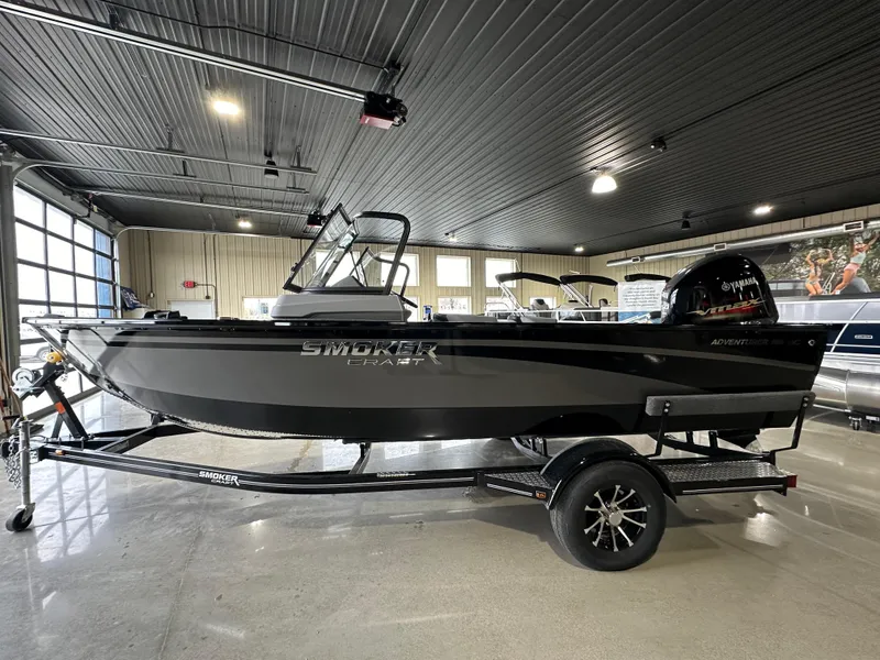 The Image of 2025 Smoker Craft Adventurer 188 DC boat in showroom, side view. - 0