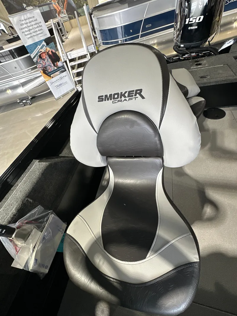 Slide: The Image of 2025 Smoker Craft Adventurer 188 DC boat seat, sleek design, black and gray upholstery. - 12
