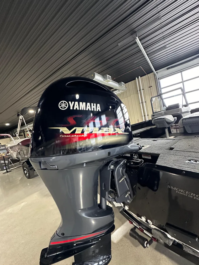 Slide: The Image of 2025 Smoker Craft Adventurer 188 DC with Yamaha VMAX outboard motor in showroom. - 14