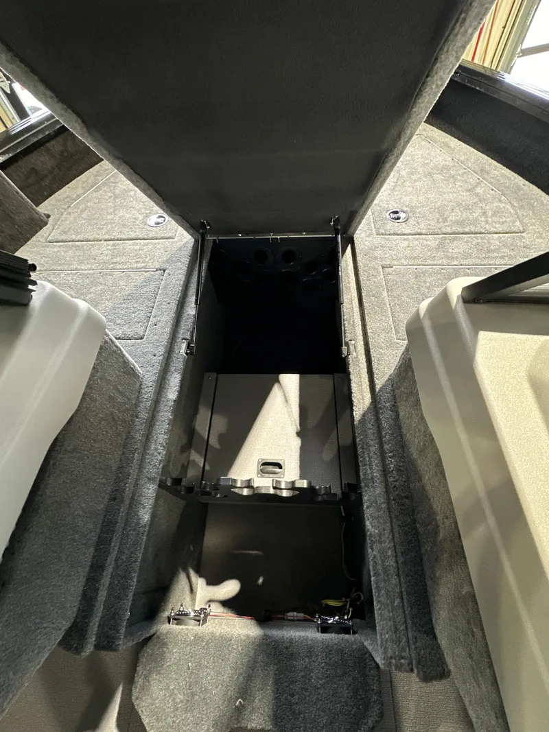 Slide: The Image of 2025 Smoker Craft Adventurer 188 DC boat interior storage compartment. - 6