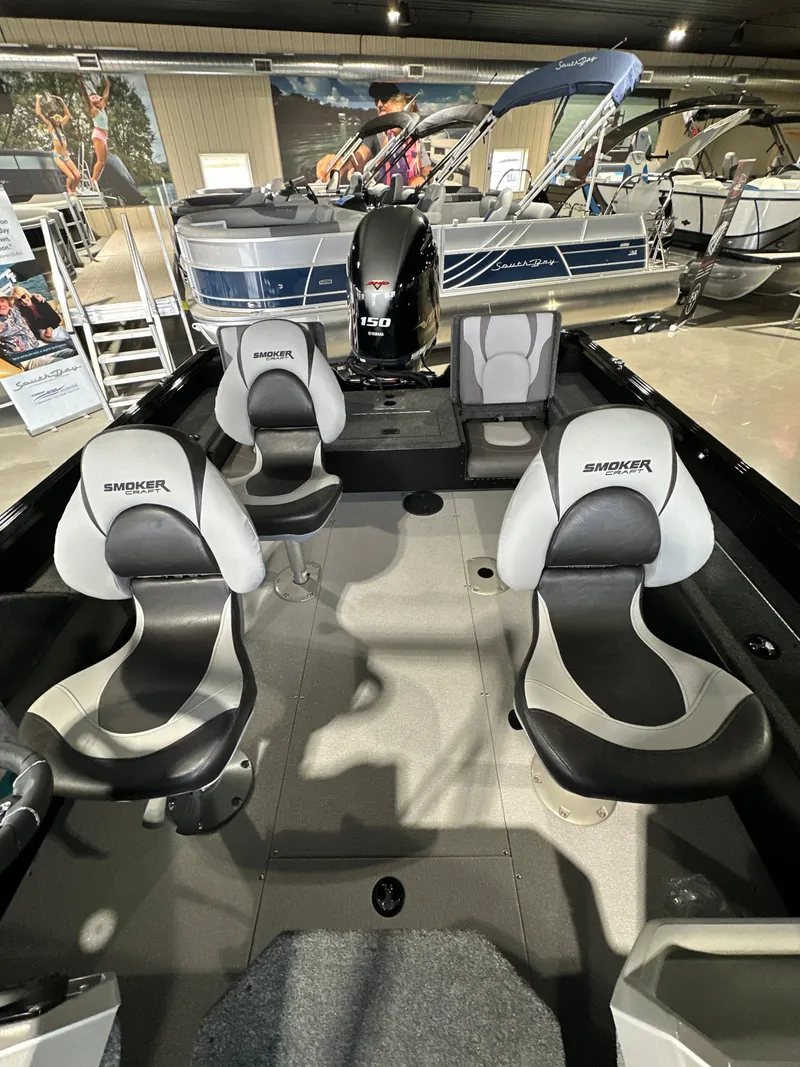 Slide: The Image of 2025 Smoker Craft Adventurer 188 DC boat interior with four seats and modern design. - 7