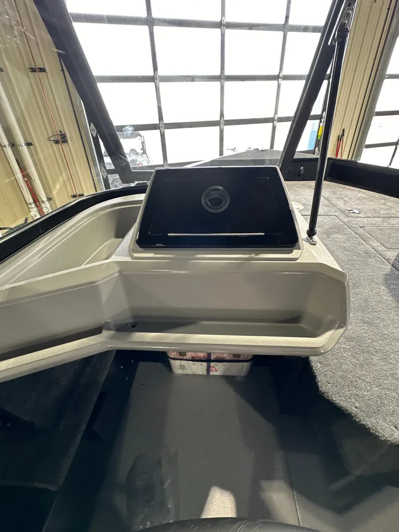 Slide: The Image of 2025 Smoker Craft Adventurer 188 DC boat interior with modern dashboard and spacious seating. - 8