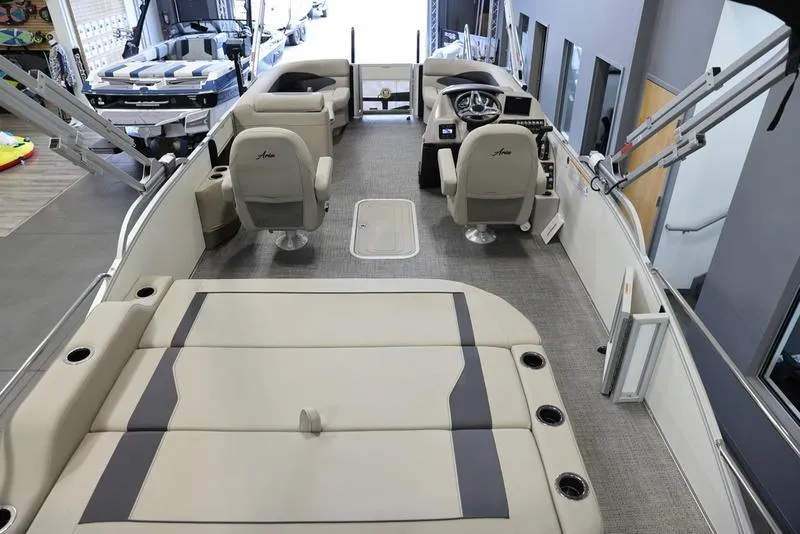 Slide: The Image of 2024 Barletta ARIA A22UC pontoon boat interior with seating and steering console. - 10