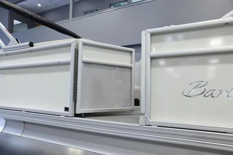 Slide: The Image of 2024 Barletta ARIA A22UC pontoon boat, white exterior detail in showroom. - 13