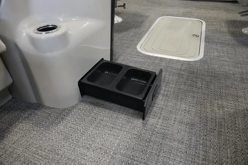 Slide: The Image of 2024 Barletta ARIA A22UC interior with built-in pet food and water bowls. - 14