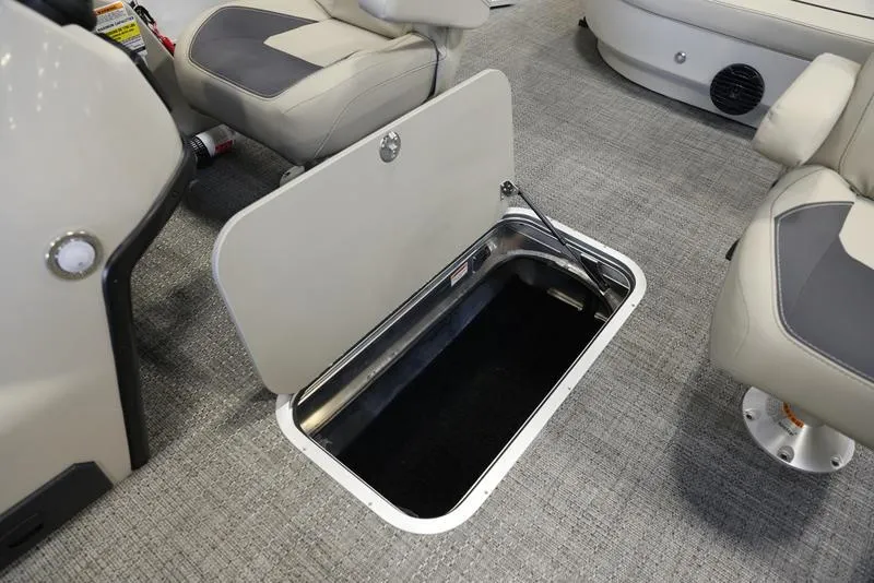 Slide: The Image of 2024 Barletta ARIA A22UC boat interior storage compartment with open hatch. - 7