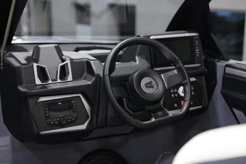 Slide: The Image of 2024 Axis T250 boat dashboard with steering wheel and control panel. - 10