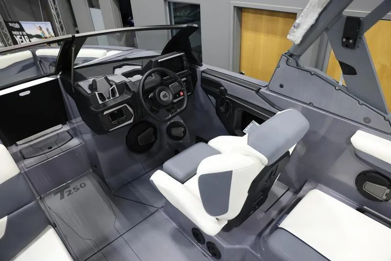 Slide: The Image of 2024 Axis T250 boat interior with modern dashboard and seating. - 12