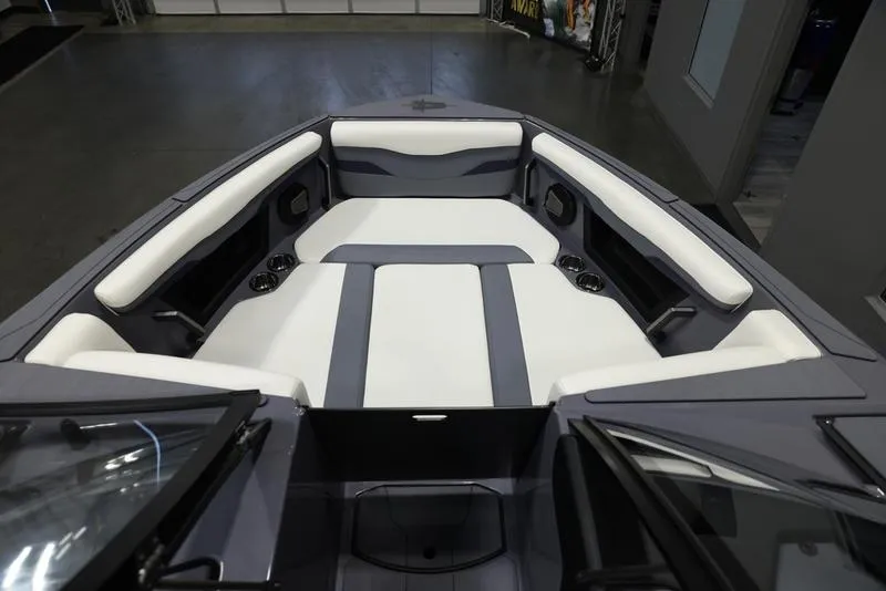 Slide: The Image of 2024 Axis T250 boat interior with cushioned seating and sleek design. - 14