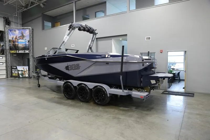 Slide: The Image of 2024 Axis T250 boat on trailer in showroom. - 3