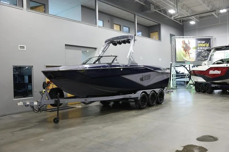 Slide: The Image of 2024 Axis T250 boat on trailer in showroom. - 5