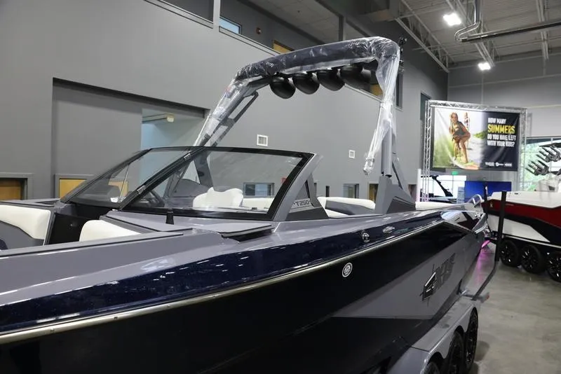 Slide: The Image of 2024 Axis T250 boat displayed indoors, showcasing sleek design and modern features. - 8