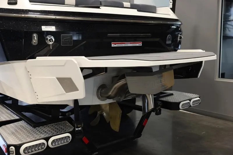 Slide: The Image of 2024 Axis A225 boat rear view with swim platform and propeller. - 14