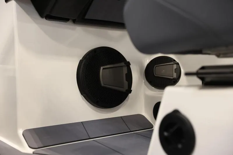 Slide: The Image of 2024 Axis A225 boat interior with built-in speakers and seating. - 16