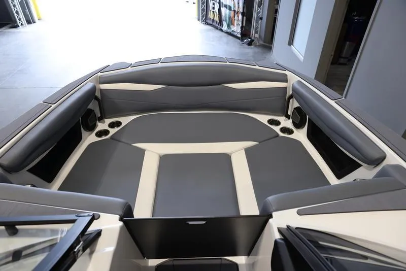 Slide: The Image of 2024 Axis A225 boat interior with gray seating and cup holders. - 6