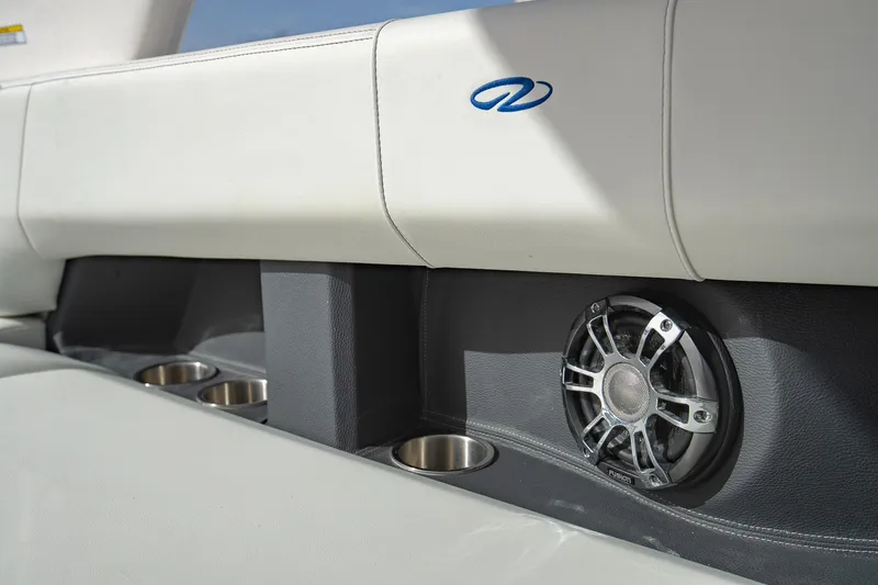Slide: The Image of 2022 Regal 2800 Bowrider interior with speaker and cup holders. - 13