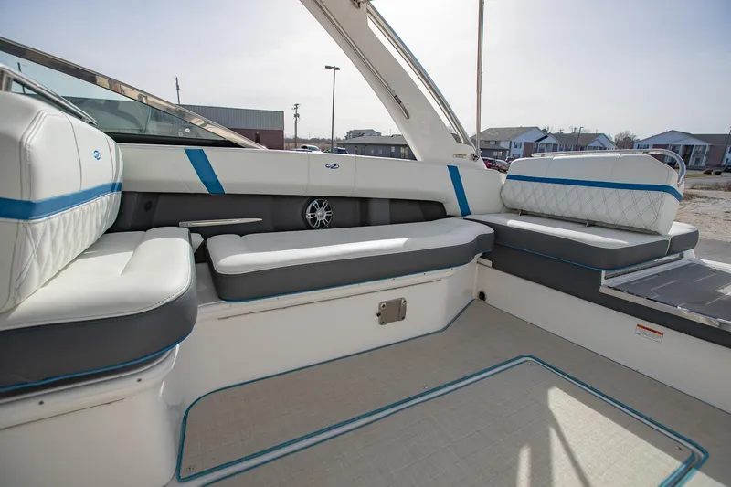 Slide: The Image of 2022 Regal 2800 Bowrider interior with white and blue seating, showcasing luxury and comfort. - 14
