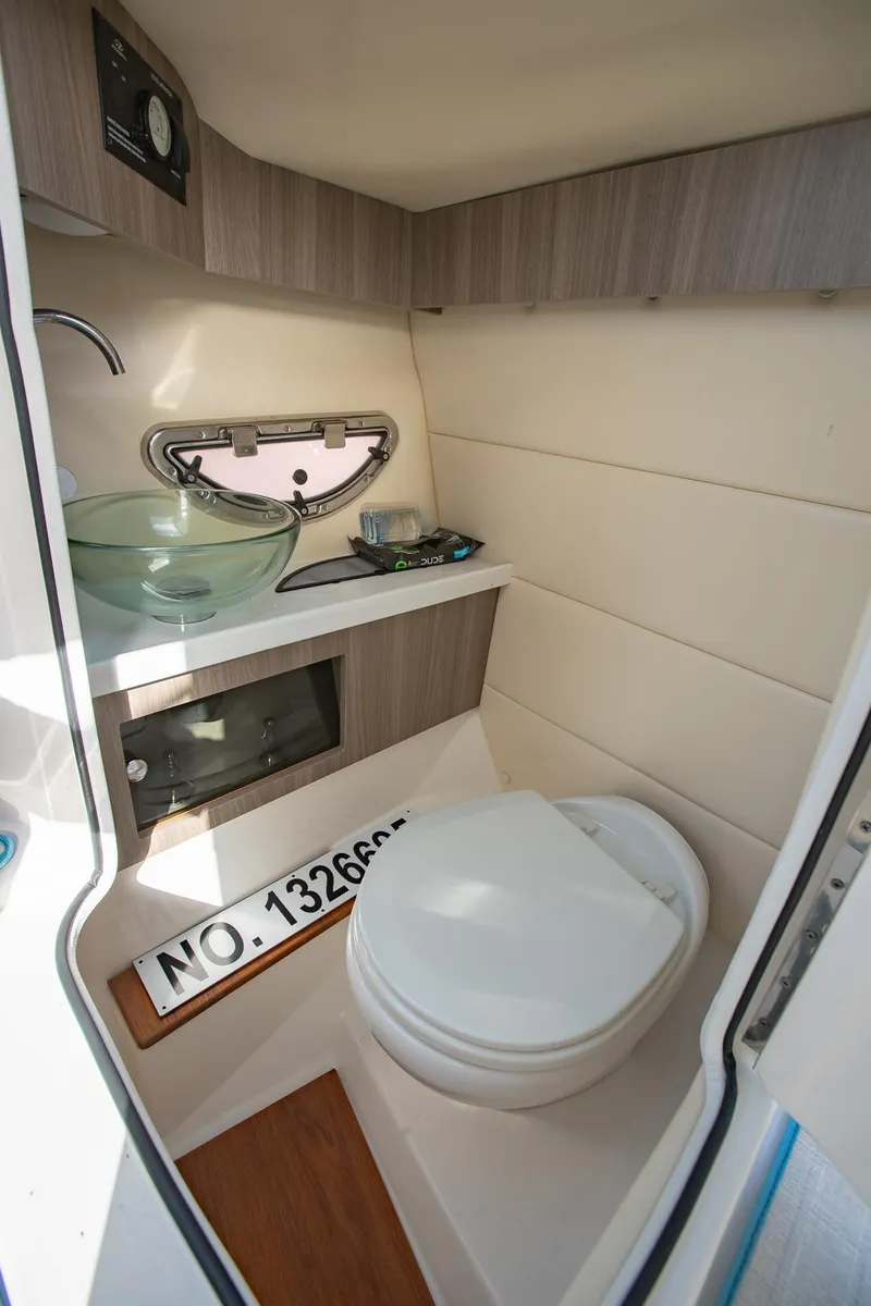 Slide: The Image of 2022 Regal 2800 Bowrider interior bathroom with modern sink and toilet. - 16