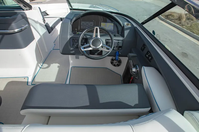 Slide: The Image of 2022 Regal 2800 Bowrider cockpit with modern steering wheel and dashboard controls. - 20