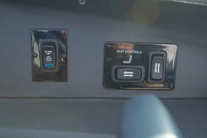 Slide: The Image of Control panel of 2022 Regal 2800 Bowrider with seat and wiper controls. - 27