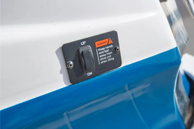 Slide: The Image of Close-up of a 2022 Regal 2800 Bowrider switch with warning label. - 37
