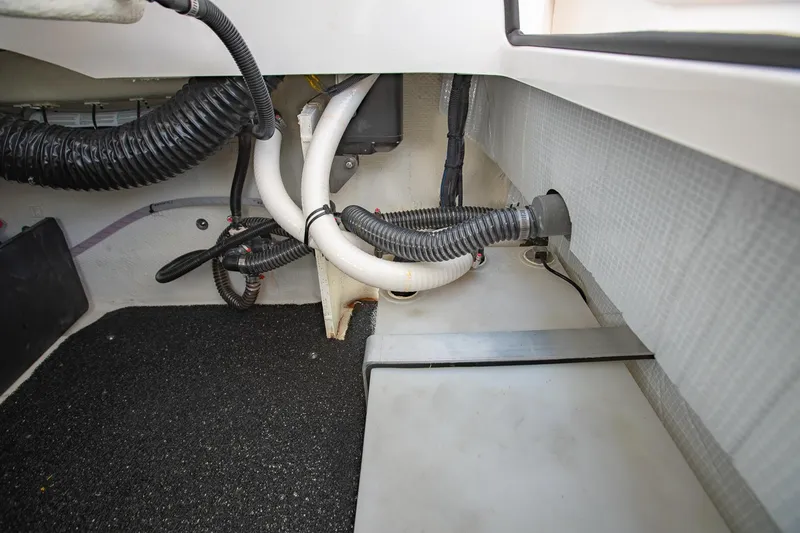 Slide: The Image of Interior view of 2022 Regal 2800 Bowrider boat showing wiring and tubing. - 41