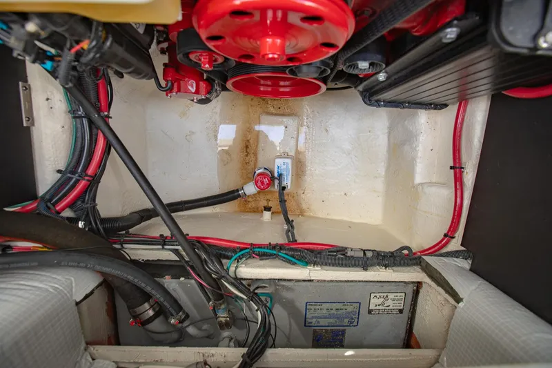 Slide: The Image of Engine compartment of 2022 Regal 2800 Bowrider with visible wiring and components. - 42