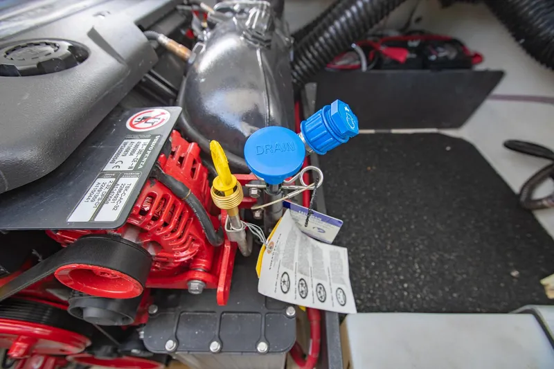 Slide: The Image of Engine compartment of 2022 Regal 2800 Bowrider with visible components and labels. - 43
