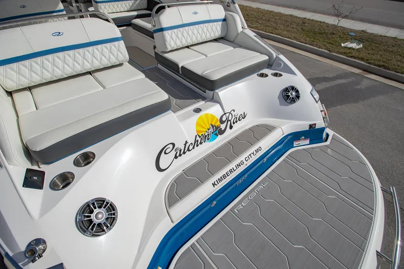 Slide: The Image of 2022 Regal 2800 Bowrider boat with custom seating and audio system. - 5
