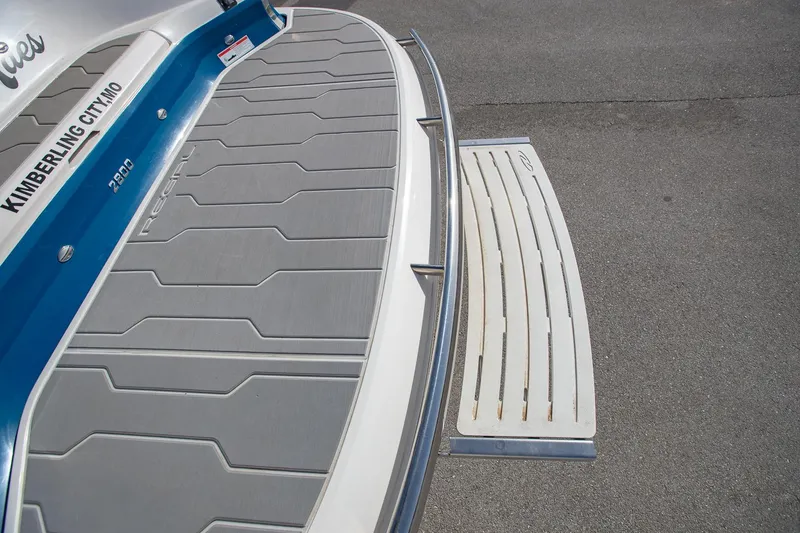 Slide: The Image of 2022 Regal 2800 Bowrider swim platform with gray non-slip surface. - 7