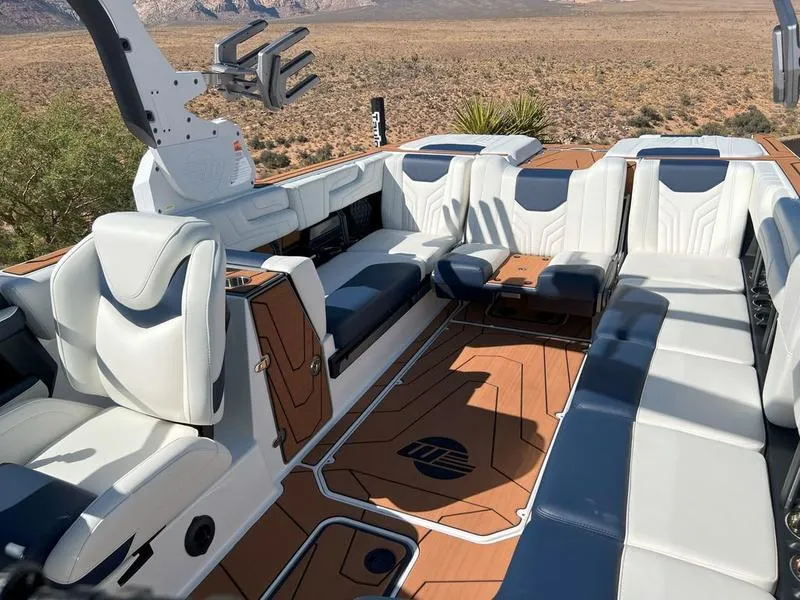 Slide: The Image of 2025 Malibu 25 LSV boat interior with luxurious seating and modern design. - 22