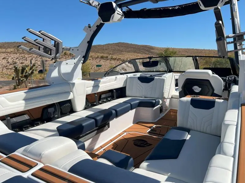 Slide: The Image of 2025 Malibu 25 LSV boat interior with luxurious seating and modern design. - 23