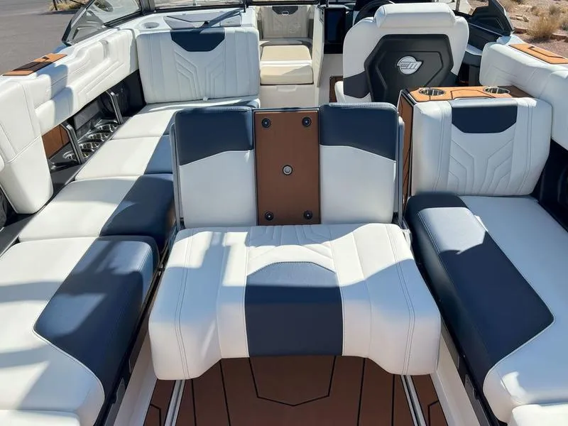 Slide: The Image of 2025 Malibu 25 LSV boat interior with luxurious seating and modern design. - 26