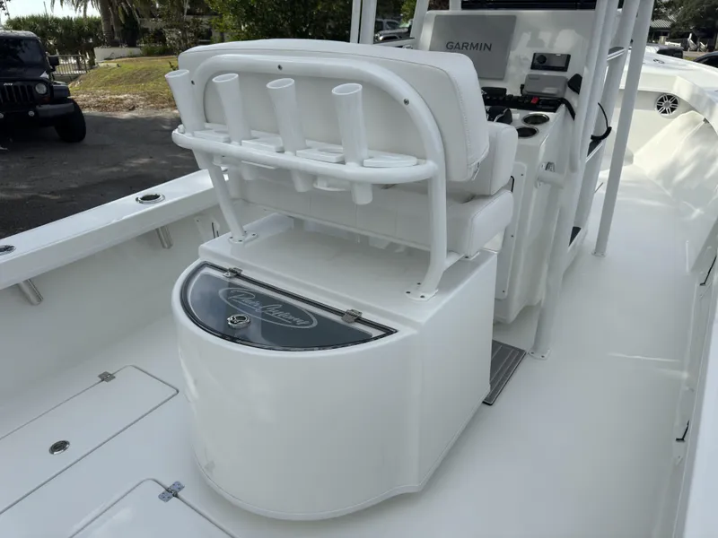 Slide: The Image of 2025 Pair Customs 24DV boat interior with seating and rod holders. - 19