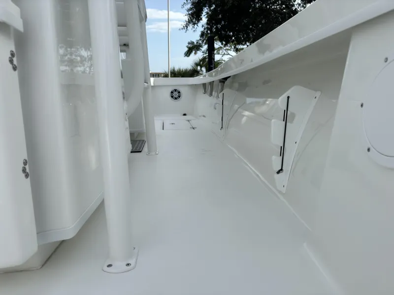 Slide: The Image of 2025 Pair Customs 24DV boat interior, sleek white deck with modern design elements. - 9