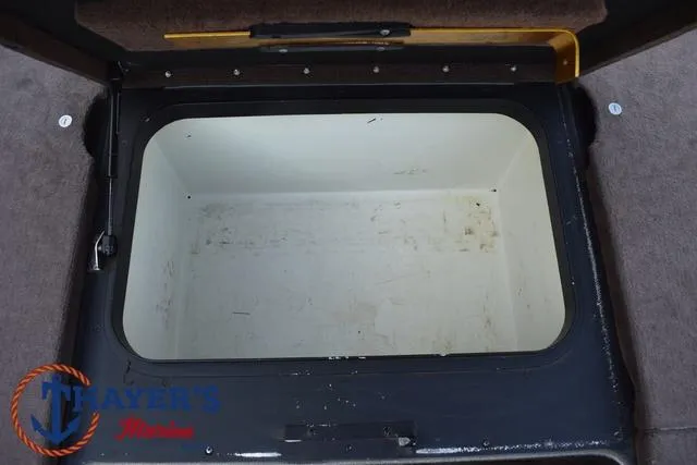 Slide: The Image of Open storage compartment in a 2010 Skeeter ZX225 boat. - 14