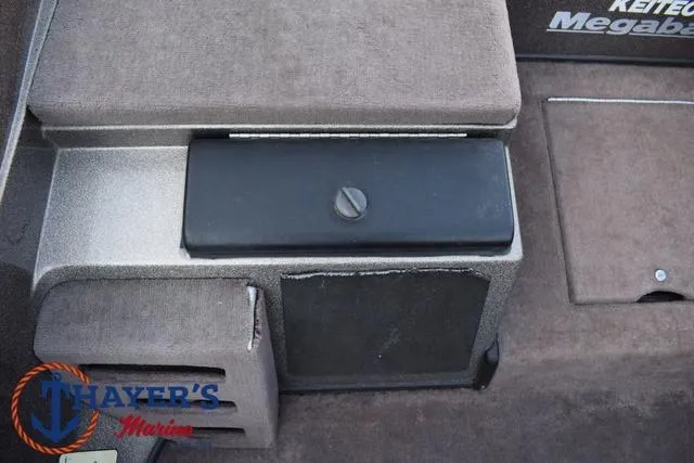 Slide: The Image of 2010 Skeeter ZX225 boat interior with storage compartments and Thayer's Marine logo. - 22