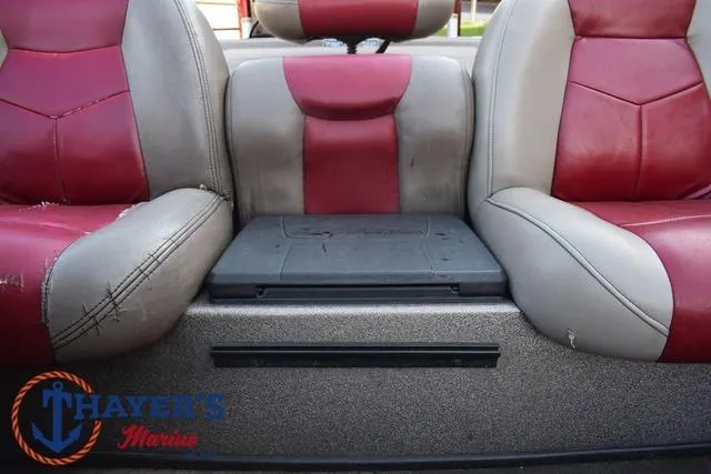 Slide: The Image of 2010 Skeeter ZX225 boat seats with red and gray upholstery, featuring Thayer's Marine logo. - 25