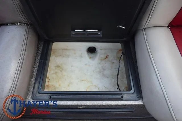 Slide: The Image of Open storage compartment in 2010 Skeeter ZX225 boat interior. - 26