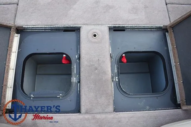 Slide: The Image of Skeeter ZX225 2010 boat storage compartments with Thayer's Marine logo. - 36